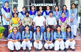 Students of Guru Nanak Model Senior Secondary School pose with their teachers and coaches in Doraha on Thursday.