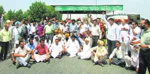 The activists protest at Ladhowal toll plaza in Ludhiana on Thursday.