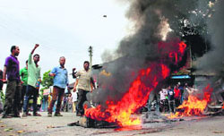 Protesters burn tyres at the National Highway-38 in Tinsukia district on Thursday against the killing of Assamese people at the Assam- Nagaland border in Golaghat