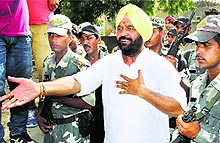Congress' Talwandi Sabo candidate Harmohinder Singh Jassi outside a polling booth