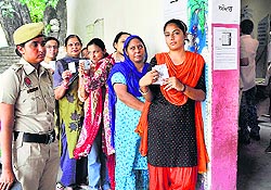 Women outside a polling booth