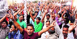 Uttarakhand Roadways Karamchari Union members stage a protest in Dehradun on Thursday