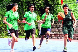 Players try to snatch the ball at the District Youth (Under-16) Basketball Championship at The Aryan School in Dehradun on Thursday