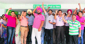 Workers of the Civil Hospital shun work for an hour to protest against the attack on a health team by a mob at a private hospital during a raid yesterday in Amritsar.
