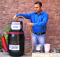 Sanjev Sayal displays the  functioning of a bio-fuel plant at a school near Amritsar.