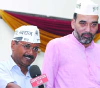 AAP convener Arvind Kejriwal with party leader Gopal Rai addressing a press conference on the removal of Sanjeev Chaturvedi from the post of Chief Vigilance Officer (CVO) of AIIMS, in New Delhi on Friday. Tribune Photo: Mukesh Aggarwal