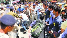 Activists of the ABVP clash with policemen during a protest at Himachal Pradesh University in Shimla on Friday.