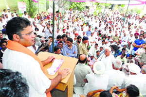 State Congress president Ashok Tanwar addresses party workers in Sirsa on Friday.
