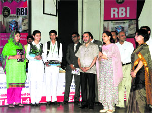 The winning team of Srinagar DPS with the RBI team, Deputy Commisioner Farooq Shah and Principal of Government College for Women Shaheen Altaf in Srinagar on Friday.