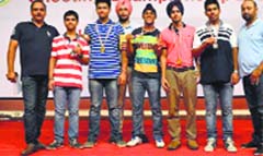 City shooters with their medals in Amritsar. A Tribune photograph