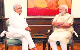 Prime Minister Narendra Modi with Haryana Chief Minister Bhupinder Singh Hooda in New Delhi on Friday.