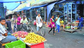 Shops open after curfew was relaxed in Golaghat, Assam, on Friday.
