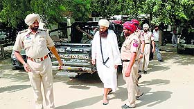 Baba Baljit Singh Daduwal being taken to a Faridkot court on Friday.