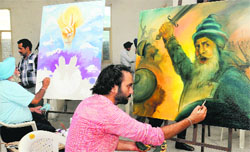 Artists give finishing touches during VIBGYOR art workshop organised by the Sobha Singh Memorial Chittarkar Society at Teachers Home in Bathinda on Saturday. Tribune photo: Pawan Sharma
