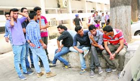 Friends of the accident victims wait for their family members at the GMSH, Sector 16, Chandigarh, on Saturday.