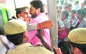 Protesting NSUI members and students of Dr Harvansh Singh Judge Institute of Dental Science and Hospital try to enter the premises at Panjab University on Saturday.
