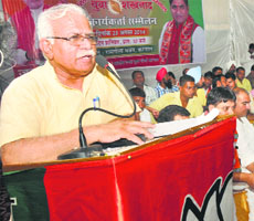 National executive member of BJP Manohar Lal Khattar addresses party workers during the Youth Sammelan in Karnal on Saturday.