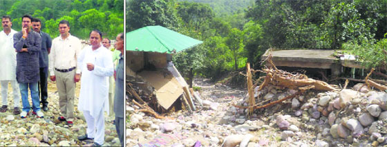 MP Anurag Thakur and Dharampur MLA Mahender Singh during their visit to a disaster-hit area in Mandi on Saturday.