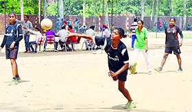 Girls battle it out in a handball match during the Punjab State Inter District School Games in Ludhiana on Saturday. 