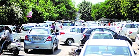Vehicles parked haphazardly outside Hotel Park Plaza, the venue for a wedding exhibition, in Ludhiana. 