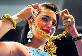 A neckpiece catches the fancy of a girl during Wedding Asia Exhibition in Ludhiana. 