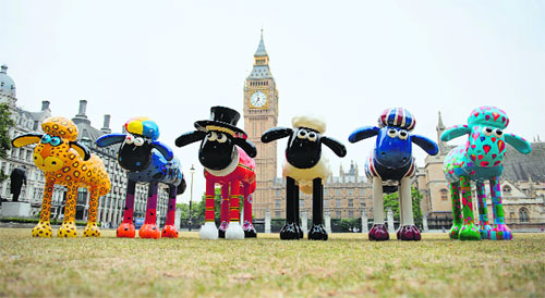 A selection of Shaun the Sheep figures, decorated by artists and celebrities, are displayed in Parliament Square, central London, England.