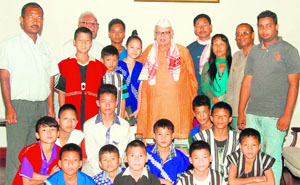 Governor Dr Aziz Qureshi with tribal students from the North-East in Dehradun on Saturday.