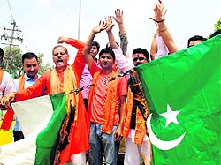 Shiv Sena (Samajwadi) activists burn a Pakistani flag in Amritsar on Sunday to protest rocket attacks in border villages