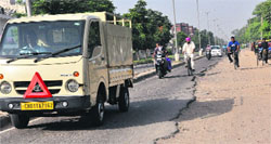 The road dividing Sectors 45 and 46 is in poor shape. Tribune photo: Parvesh Chauhan