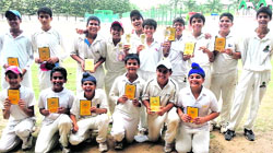 Saupins team in a jubilant mood after lifting the cricket cup in Chandigarh. A tribune photograph 