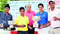 (From left) Local golfers Aadil Bedi, Jaiveer Singh, Karandeep Kochar and Jairaj Singh with their trophies during the felicitation ceremony at the Delhi Golf Club. A tribune photograph 