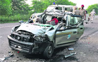The mangled remains of an Alto car that rammed into a stationary truck at Khaspur village on the Banur-Tepla -Ambala Highway near Dera Bassi on Sunday. A Tribune photograph