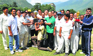 Members of the Press Club hold the trophy after winning the friendly cricket match on the concluding day of the Red Cross fete in Kullu on Sunday