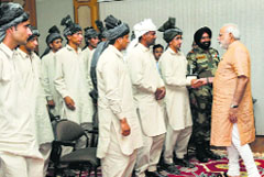Prime Minister Narendra Modi meets members of the Gujjar and Bakerwal communities of Jammu and Kashmir, in New Delhi. A Tribune Photograph