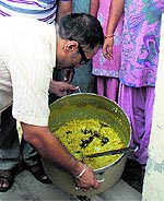 A mid-day meal being inspected by the Health Department