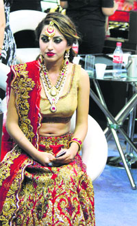 A model dressed as a bride on the last day of the Wedding Asia Exhibition in Ludhiana.