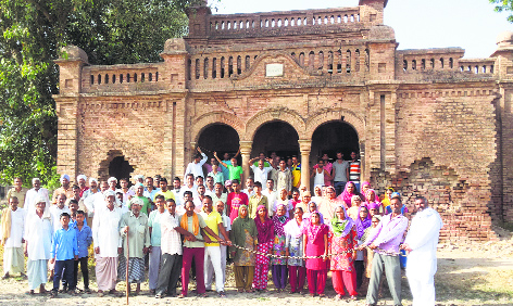 Residents gather before Raghuvar Bhawan in Fazilka.