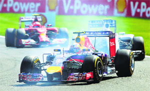 Red Bulls Daniel Ricciardo, Australia, takes a curve ahead of Williams Valtteri Bottas, Finland, and Ferraris Kimi Raikkonen (rear) during the Belgian F1 Grand Prix in Spa-Francorchamps on Sunday