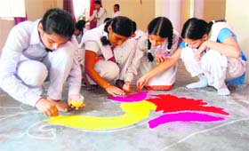 Students take part in a rangoli competition as part of the week-long cultural festival at Sati Kund in Haridwar on Sunday