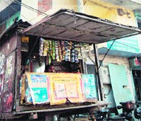 A cigarette and tobacco vendor, who shares the boundary wall with St Marys School, on the Majitha road in Amritsar. A Tribune Photograph