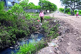 The president of Mohali Industries and Commerce Association, Nikhil Saraf, shows the storm water pipeline allegedly carrying industrial waste and sewage in Sector 74, Mohali. 