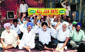 Members of the All J&K SRTC Volunteer Retirement Employees Association protest in Jammu on Monday.