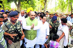 BJP national president Amit Shah interacts with border residents affected by Pakistan shelling. 