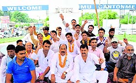 Members of the Sharnarthi cell of the J&K BJP sit on a hunger strike at Satwari Chowk in Jammu on Monday.