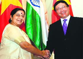 Minister for External Affairs Sushma Swaraj shakes hands with Vietnamese Deputy Prime Minister Pham Binh Minh in Hanoi on Monday