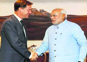 Prime Minister Narendra Modi greets with UK Deputy PM Nick Clegg in New Delhi on Monday