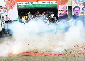 Congress workers celebrate the partys victory in Bengaluru