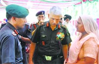 A widow interacts with Army officers in Ferozepur on Monday. Tribune photo