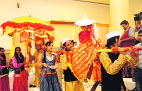 Artistes present the scene of the Nanda Devi Raj Jaat Yatra in Dehradun on Monday