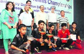 Winners of the District Table Tennis Championship in Dehradun on Monday